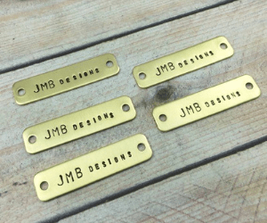 "Orkay Engraver Pvt Ltd's high-quality metal engraved tags, showcasing a variety of materials and customization options for diverse applications"